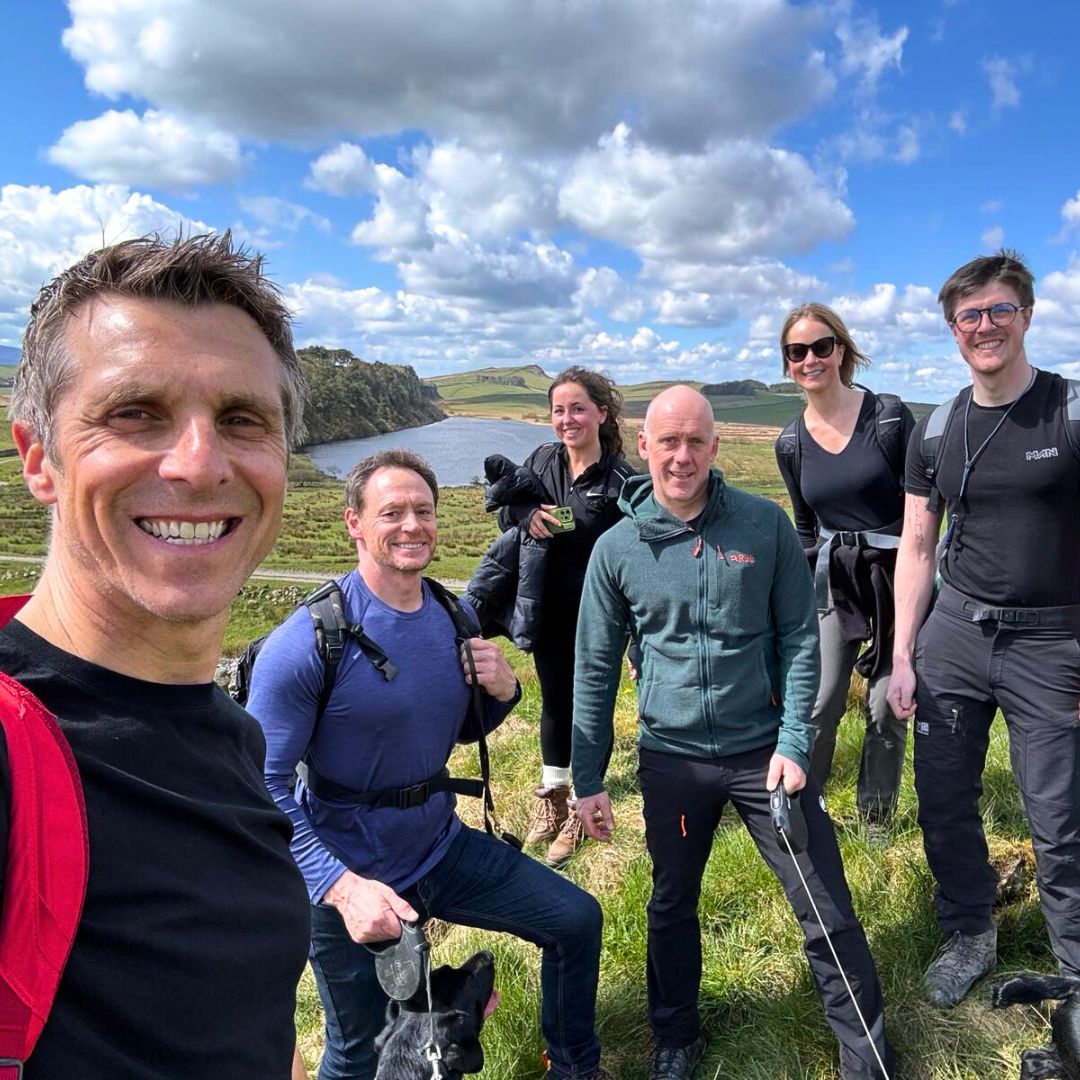 Team trekking at Sycamore Gap